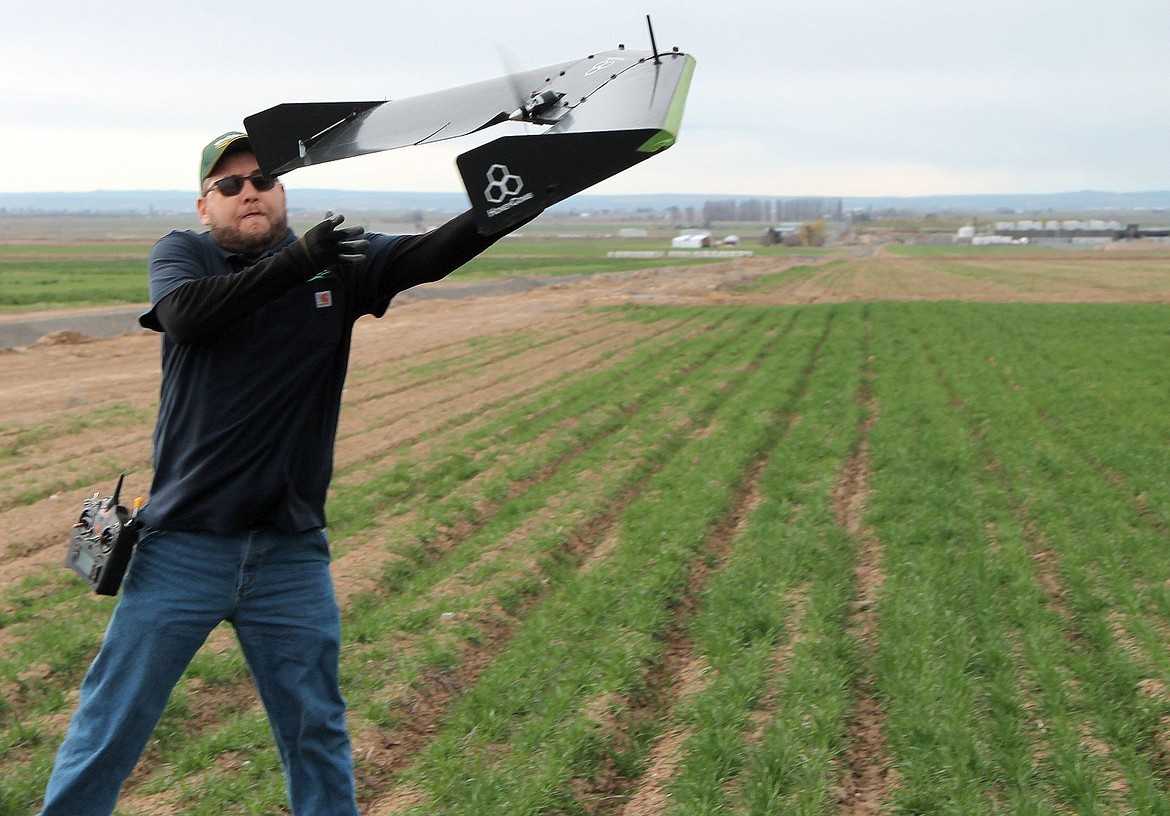 &lt;span&gt;AMS consultant Steve Gardner with Washington Tractor launches a HoneyComb AgDrone in a field near Quincy.&lt;/span&gt;