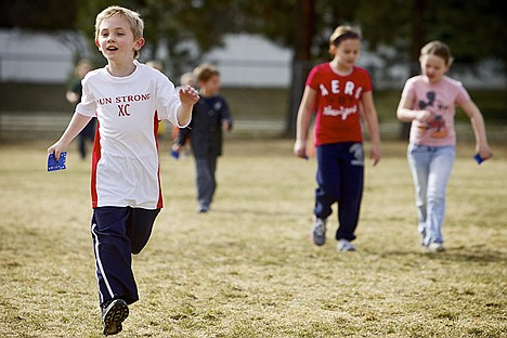 &lt;p&gt;Zachary Anderson, 6, closes in on the finishing another 1/4-mile lap Monday during the Holy Family Catholic School run for fun after school program.&lt;/p&gt;