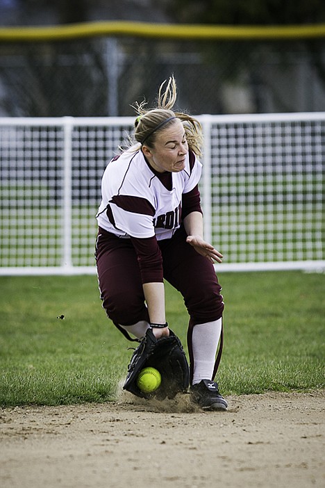 <p>Kellsi Parson fields the ball in the fifth inning against Salt Lake Community College.</p>