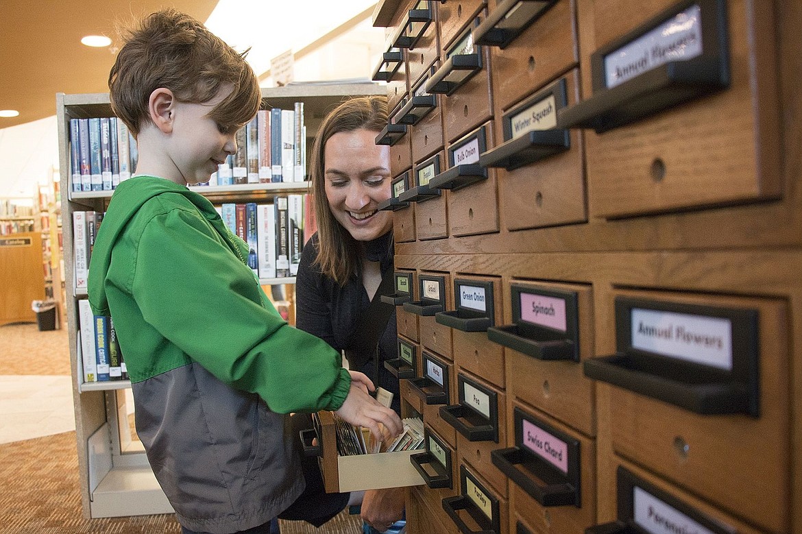 &lt;p&gt;Max Palmer, 4, looks at beet seeds in the True to Seed library at the Coeur d&#146;Alene Public Library with his mom, Katie. Max said he is going to plant a garden with flowers and broccoli.&lt;/p&gt;