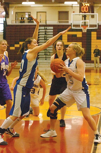 Mission junior Adessa Durglo tries to block Mission senior Kyla Mitchell from scoring during the girls all-star game.