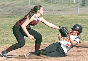 &lt;p&gt;Shortstop Aurora Becquart puts the tag on Jena Peterson for the third out top of third first of a doubleheader vs. Plains March 27, 2015.&lt;/p&gt;
