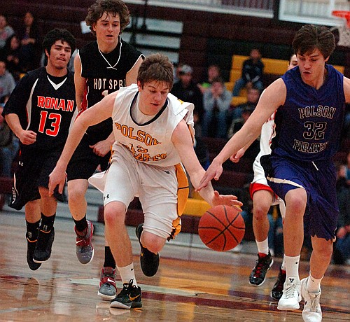 Polson teammates Kyle Bagnell and Louis Mohr go for a loose ball.