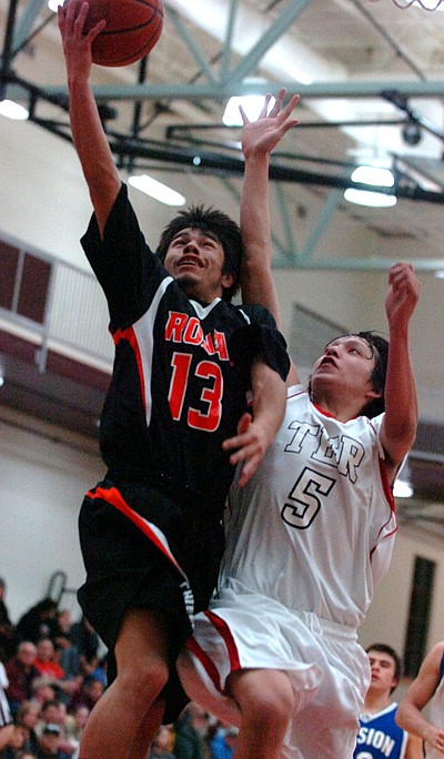 Ronan's Lucas Black lays the ball up.