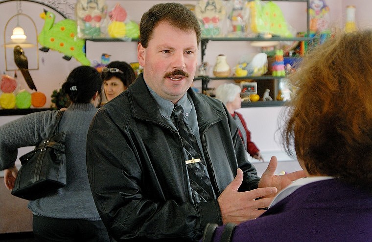 Flathead County Sheriff&#146;s Office Sgt. Lance Norman, one of three Republican candidates for sheriff, talks with a woman in the crowd following a Lakeside-Somers Chamber of Commerce forum Tuesday.