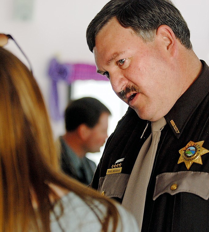 Incumbent Flathead County Sheriff Mike Meehan speaks with Rebekah King following the Chamber forum. Meehan said his goal is public safety and protecting citizens&#146; property.