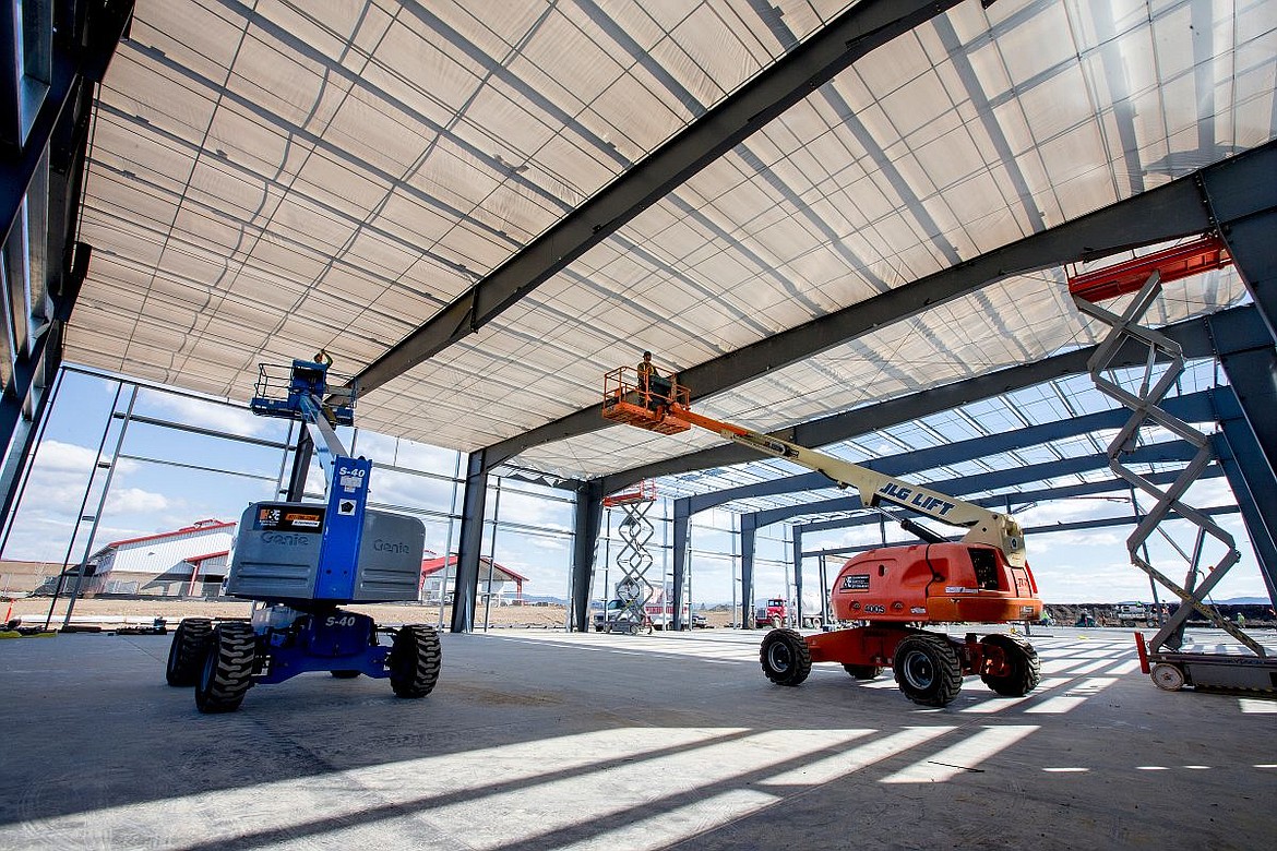 &lt;p&gt;Construction workers build the roof on Tuesday to what will house a diesel technology facility at the North Idaho College Career and Technical Education facility in Rathdrum. The 110,960-square-foot complex will bring NIC's current facilities up-to-date, safer for students, faculty and visitors, and large enough to allow the most robust education.&lt;/p&gt;