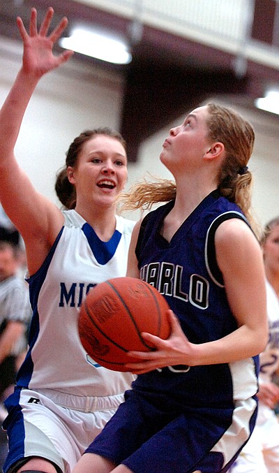 Charlo's Dawn Blevins goes up against Mission's Kyla Mitchell.