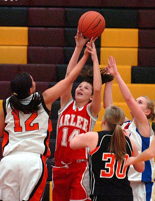 Arlee's Whitney Malatare tries to get a rebound.