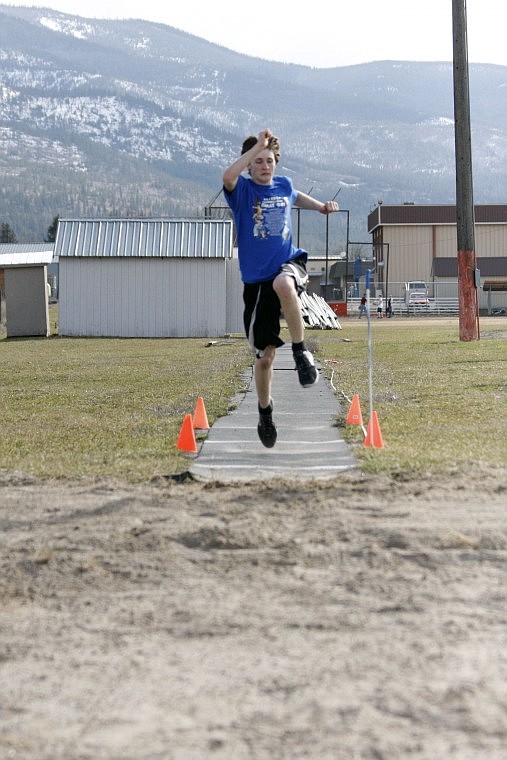 Plains freshman Kaleb Beech takes a long leap at practice last week while preparing to compete in the long jump. Beech will participate in the first meet of his high school career this Saturday in Frenchtown.