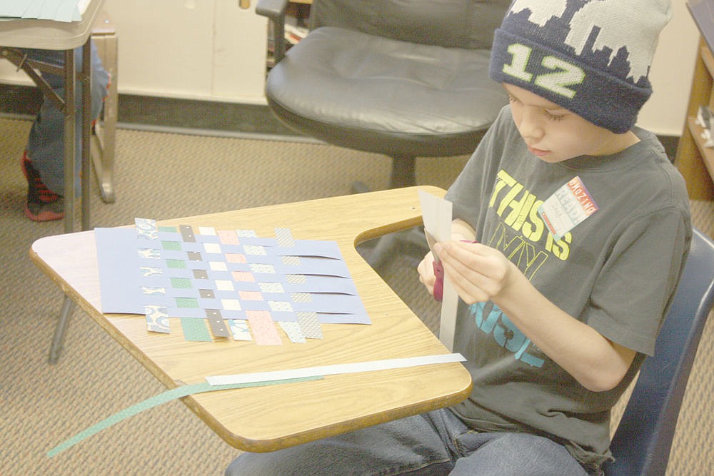 &lt;p&gt;Jack Clevenger gets experience weaving during a medieval style fair last week in Alberton during &quot;I love to Read Month.&quot;&lt;/p&gt;