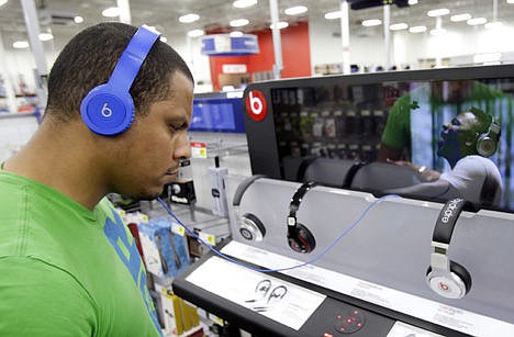 &lt;p&gt;Eric Soriano listens to music with a pair of Beats headphones at a Best Buy store in Orlando, Fla.&#160;&lt;/p&gt;