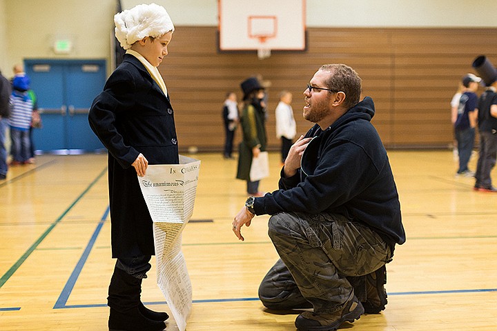 &lt;p&gt;SHAWN GUST/Press&lt;/p&gt;&lt;p&gt;Richard Schutte talks with his son Luke, playing Thomas Jefferson, after a presentation about the historical figure during a wax museum event Tuesday as part of a Prairie View Elementary third grade biography course at the Post Falls school.&lt;/p&gt;
