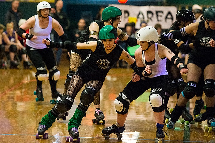 &lt;p&gt;SHAWN GUST/Press&lt;/p&gt;&lt;p&gt;Snake Pit Derby Dames jammer Bangerang Bambi, left, pushes Back Alley Skates blocker B Donkadonk during a first half jam of Saturday&#146;s bout at Skate Plaza in Coeur d&#146;Alene. The Snake Pit Derby Daems won the bout 210-131.&lt;/p&gt;