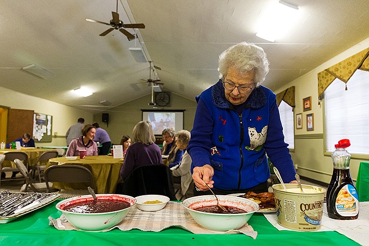 &lt;p&gt;SHAWN GUST/Press&lt;/p&gt;&lt;p&gt;Barbara Campbell, a 14-year member of St. Luke&#146;s Episcopal Church, chooses a fruit topping for her pancake dinner Tuesday during a special dinner hosted by the men of the Coeur d&#146;Alene church. The event, one of four different meal fundraisers per year, has been held for several decades in observance of the season of Lent, a Christian tradition beginning 40 days prior to Easter.&lt;/p&gt;