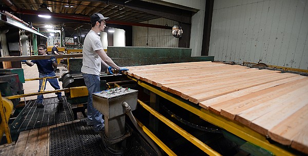 &lt;p&gt;Employees sort cut boards at the Plum Creek sawmill in Evergreen on Wednesday morning. Wednesday was the first full day of production at the sawmill, which has been closed since June 2009.&lt;/p&gt;