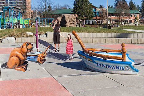 &lt;p&gt;Lucreita MacEvil of Coeur d' Alene and her daughter, Lucy, look on in astonishment at the new arrival on McEuen Park's splashpad. Nobody seems to know what the new creature is, or how and where it might have originated.&lt;/p&gt;