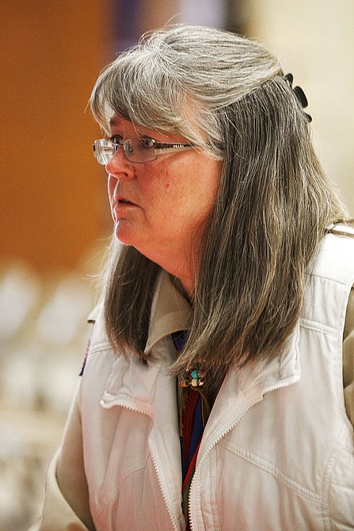 <p>Troop leader Mary Jo Cramer arranges tables Thursday evening before the presentation of Eagle awards to seven Boy Scouts in troop #1901 at Edgerton Elementary School.. Thursday, March 28, 2013 in Kalispell, Montana. (Patrick Cote/Daily Inter Lake)</p>