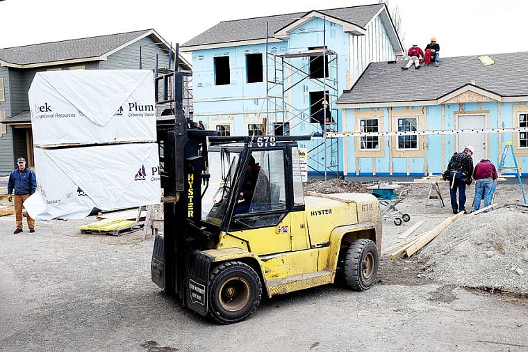 &lt;p&gt;A pallet of manufactured lumber studs is unloaded Wednesday afternoon at Habitat for Humanity&#146;s Columbia Falls Affordable Housing project. Plum Creek donated 700 studs that will be used for framing two more houses.&lt;/p&gt;