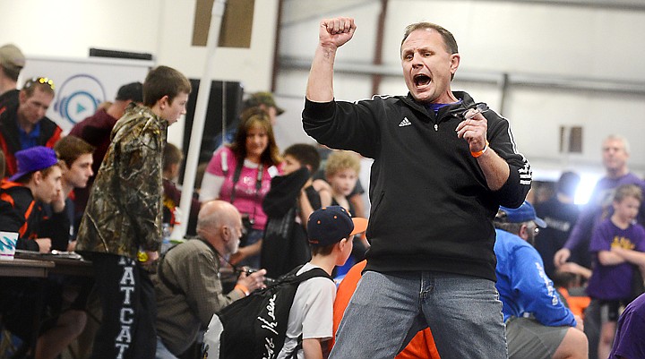 &lt;p&gt;Coach and father Scott Wilson of Polson cheers as his son Trent wins the championship round of the novice 80 weight class of the at the Little Guy State Wrestling tournament on Saturday, March 29, at the Northwest Montana State Fairgrounds. (Brenda Ahearn/Daily Inter Lake)&lt;/p&gt;