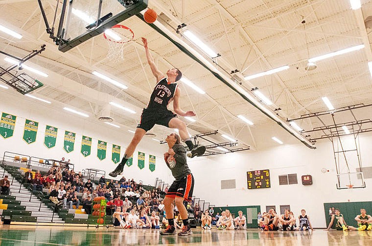 &lt;p&gt;Flathead senior Matt Quist (13) jumps over freshman Kelsey Noland-Gillespie during the dunk contest Tuesday evening at the 13th Annual Les Scwab Shoot Out at Whitefish High School. March 25, 2014 in , Montana. (Patrick Cote/Daily Inter Lake)&lt;/p&gt;