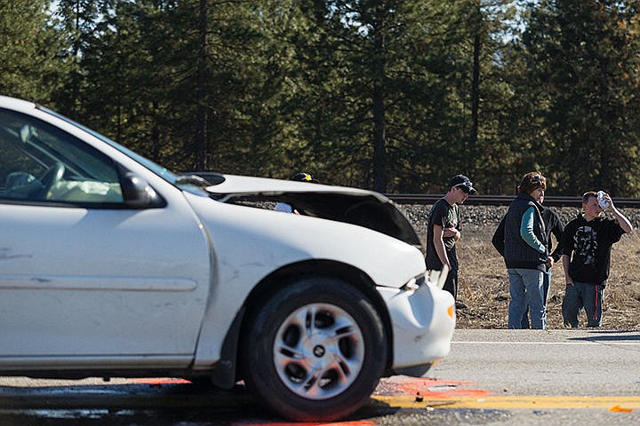 &lt;p&gt;A male that was involved in a two-car collision on highway 53 holds an ice pack to his forehead just north of the roadway Monday. Idaho State Police is investigating the cause. Minor injuries were reported.&lt;/p&gt;