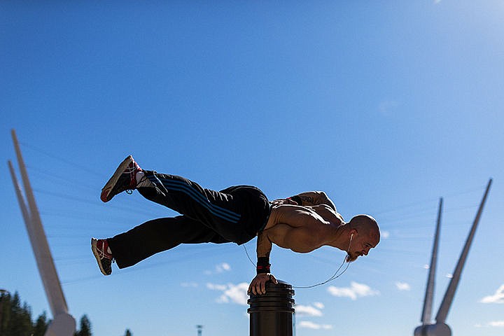 &lt;p&gt;Steve Seiver balances on a crosswalk signal post while performing extreme calisthenics that he refers to as a street workout on Thursday in downtown Coeur d&#146;Alene. The personal trainer has been practicing this type of exercise for about a year.&lt;/p&gt;