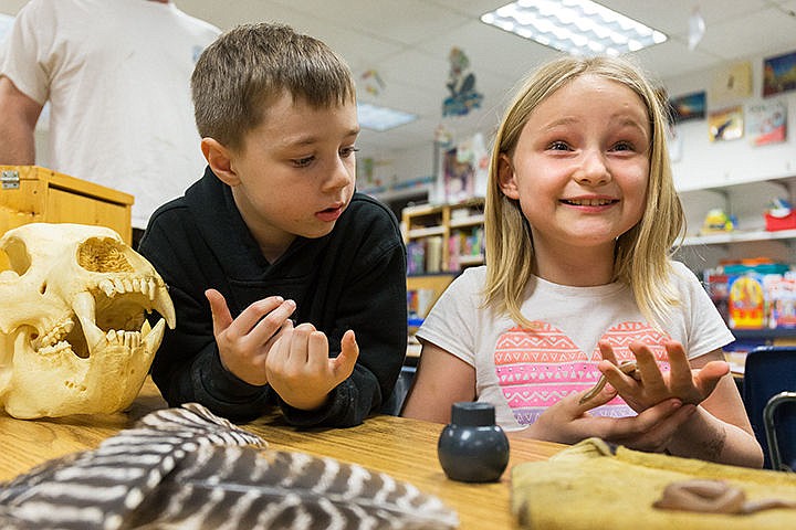 &lt;p&gt;Hunter Schlager, 6, watches as Shelby Eddy, 8, reacts while holding a baby rubber boa at the Idaho Fish and Game &#147;Creatures of the Night&#148; wildlife exhibit Monday during Fernan Elementary&#146;s Science, Technology, Engineering and Math science night in Coeur d&#146;Alene. Nearly 300 students and their families attended the event that also featured demonstrations and exhibits from Gizmo, Coeur d&#146;Alene Tribe, Mobius Science Center, North Idaho College and a falconry expert.&lt;/p&gt;