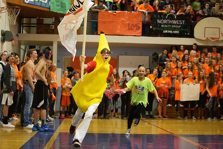 &lt;p&gt;Eighth-grader at Canfield Middle, Brock Mills runs past the Lakes Middle students to fire up the crowd at the Minnow Madness basketball game.&lt;/p&gt;