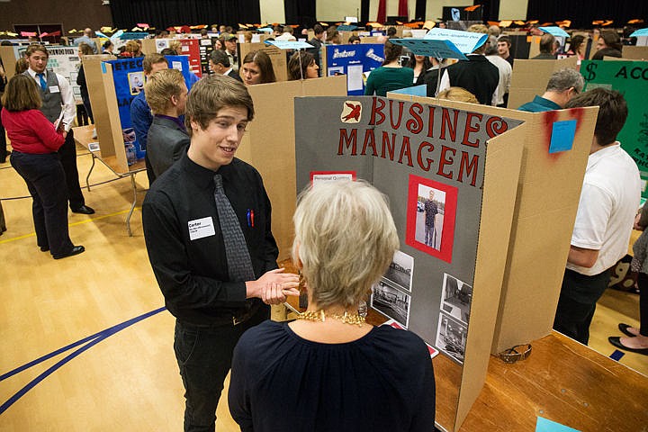 &lt;p&gt;Post Falls High School senior Carter Mattson interviews with a professional about business management at the Reverse Job Fair on Wednesday at Real Life Ministries in Post Falls. Area high school seniors made booths displaying their career interests and were interviewed by volunteers who have experience with the students desired field.&lt;/p&gt;