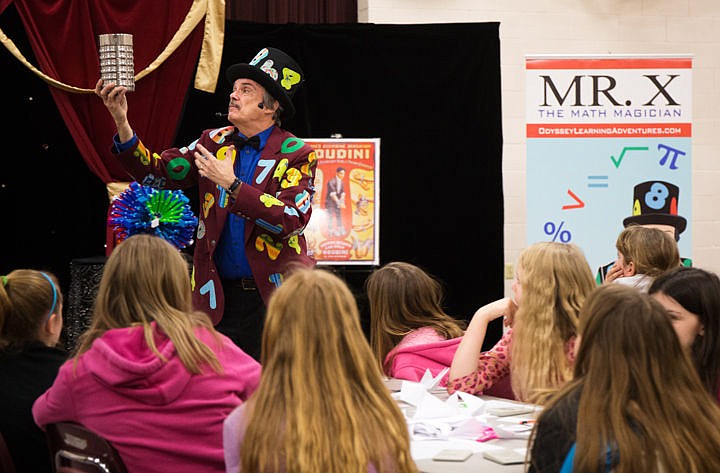 &lt;p&gt;&#160;Mr. X the Math Magician, Bob Bishop, holds up a can for his final act on Thursday at Garwood Elementary School in Rathdrum. Bishop has been visiting schools as Mr. X for 25 years to share with children his motivational workshop and to &quot;bring wonder back to mathematics,&quot; Bishop said.&lt;/p&gt;