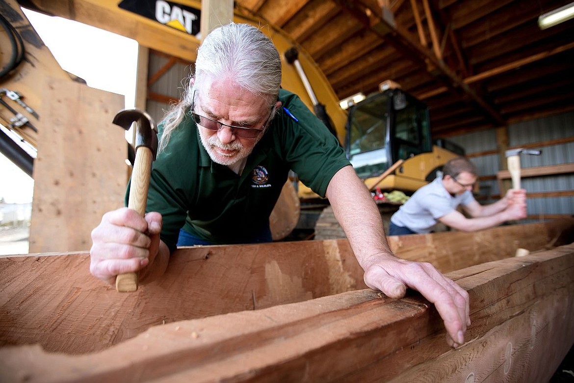 &lt;p&gt;Jeffery Jordan, left, a fisheries biologist with the Coeur d'Alene Tribe, works with Angelo Vitale to bore out a traditional canoe from the trunk of an old-growth tree on Thursday in Plummer.&lt;/p&gt;