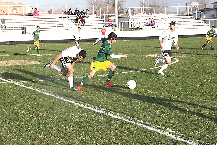 Rey Cabrera (11) of the Quincy Jacks did plenty to get the ball in scoring position for his team during yesterday's non-league tussle at Othello against the host Huskies. An early Othello score was enough for the Huskies to record a 1-0 win and set up an interesting rematch on April 26 in Quincy.