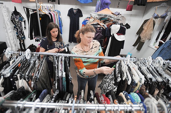 Brenda Ahearn/Daily Inter Lake
Owner Mary Pool and store manager Linda Hile of Kalispell examine the stock deciding what to keep and what can be donated on Tuesday at My Secret Treasures Annex in Kalispell.