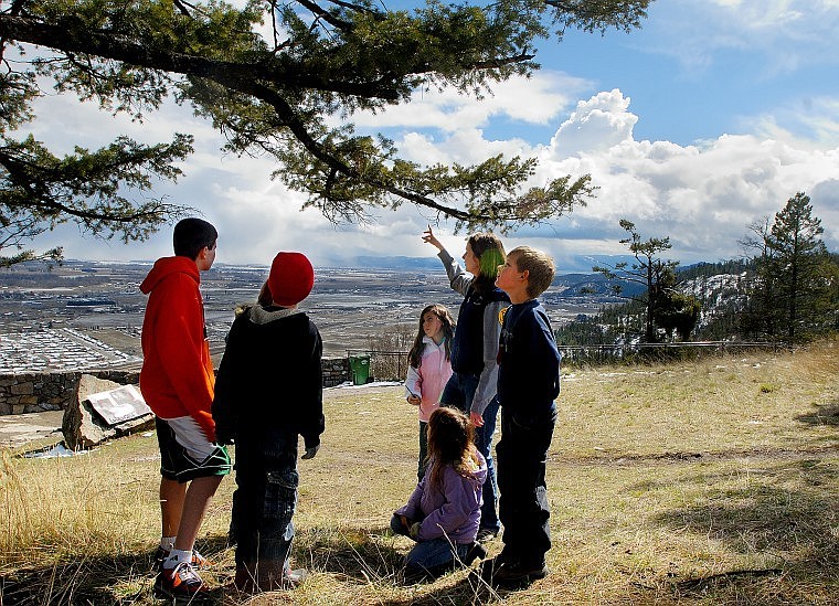 Lone Pine State Park Ranger Mary Beth Chappelow leads students on a scavenger hunt along hiking trails in the park as part of the park&#146;s first spring day camp Wednesday afternoon. The two-day event was themed &#147;Nature Scene Investigation&#148; and gave students the opportunity to learn about topics ranging from plant seedlings to collecting animal tracks.