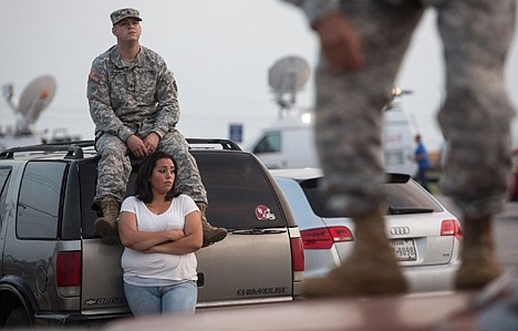 &lt;p&gt;Lucy Hamlin and her husband, Spc. Timothy Hamlin, wait for permission to re-enter the Fort Hood military base, where they live, following a shooting on base on Wednesday in Fort Hood, Texas.&lt;/p&gt;