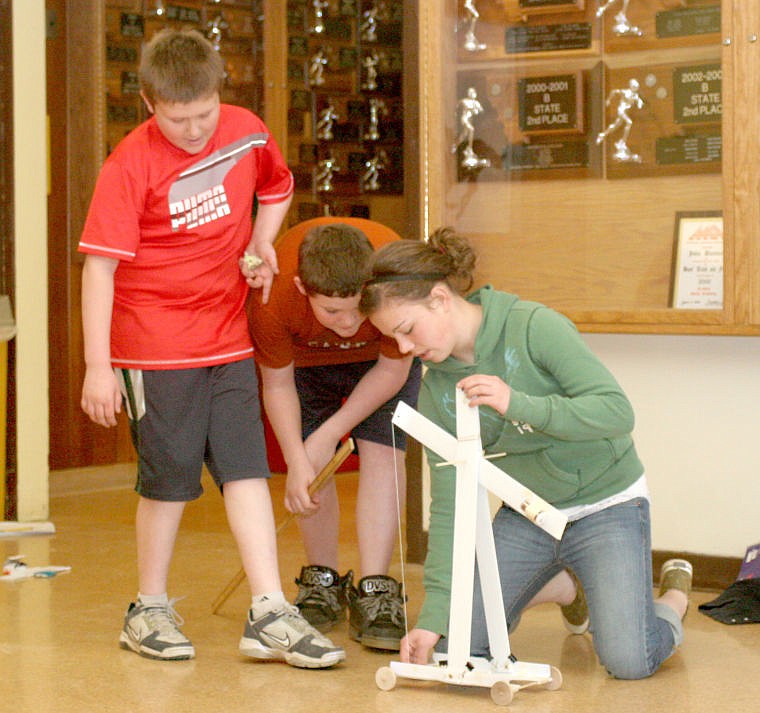 &lt;p&gt;From left to right: Connor Sampson, Alex Thomas and Haley Josephson prepare to test their gravity car.&lt;/p&gt;