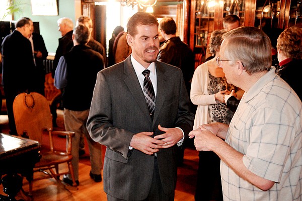 &lt;p&gt;City Manager candidate Doug Russell speaks with Mark Rice of Kalispell Thursday evening at a public reception for the city manager finalists at the Conrad Mansion.&lt;/p&gt;