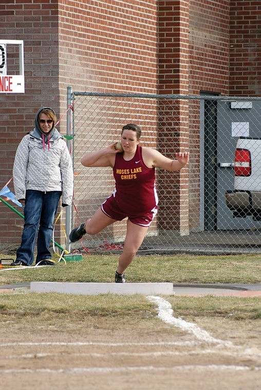 Sadie Nielsen puts the shot at the Ray Cross Invite March 24. Nielsen set a personal best with a toss of 37' 3" at the Southridge Invite March 31.