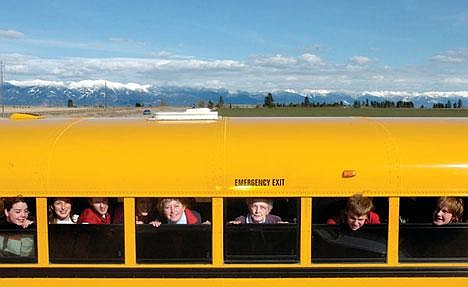 Chris Jordan/Daily Inter Lake&lt;br&gt;Sally Christensen and her mother Myrtle Hutchins, center two windows, are surrounded by Kalispell Junior High and Flathead High School students on the West Valley bus route that has been in the family for nearly 40 years. Myrtle's father Ed Kramer had the route from 1934-39. Myrtle picked it up in 1967, and drove it until 1990 when her daughter Sally took over the route.