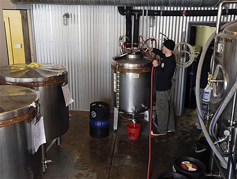 &lt;p&gt;Brewer Matthew Perry cleans a tank before making maple amber beer at Chatham Brewing in Chatham, N.Y.m, on March 20.&lt;/p&gt;