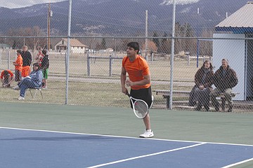 &lt;p&gt;Ronan&Otilde;s Ronnie Cullis rips a serve Thursday against Karl Daniels of the rival Mission Bulldogs. The teams played to a 3-3 draw&lt;/p&gt;