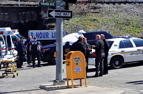 &lt;p&gt;Law enforcement officers and emergency service personnel converge on the scene of the shooting in downtown Williamson, W.Va., Wednesday, where Sheriff Eugene Crum was shot and killed at point blank range.&lt;/p&gt;