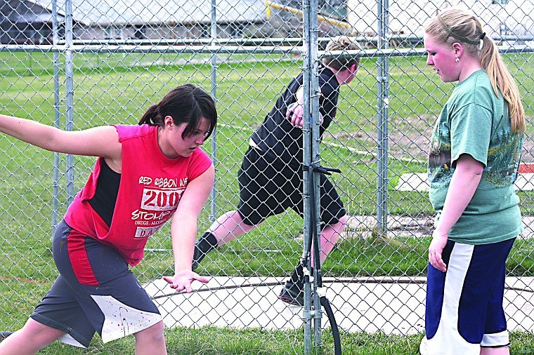 &lt;p&gt;Franky Winebrenner (left) showing Keely Benson (right) the correct stance for throwing a discus. Ben Gorham is about the throw in the background.&lt;/p&gt;