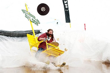 <p>Claude Boiteau loses his hat and his nachos as he lands in the pond Saturday afternoon during the 9th Annual Whitefish Mountain Resort Pond Skim. April 5, 2014 in Whitefish, Montana. (Patrick Cote/Daily Inter Lake)</p>