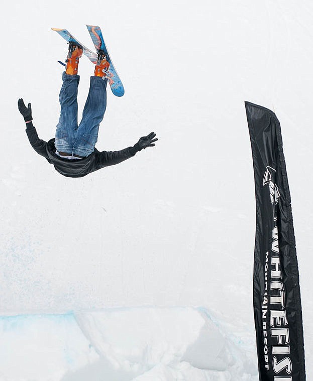 <p>Nathan Jensen throws a front flip Saturday afternoon during the 9th Annual Whitefish Mountain Resort Pond Skim. April 5, 2014 in Whitefish, Montana. (Patrick Cote/Daily Inter Lake)</p>