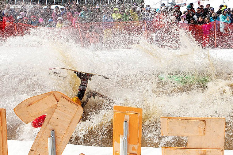 <p>A competitor falls in the water Saturday afternoon during the 9th Annual Whitefish Mountain Resort Pond Skim. April 5, 2014 in Whitefish, Montana. (Patrick Cote/Daily Inter Lake)</p>