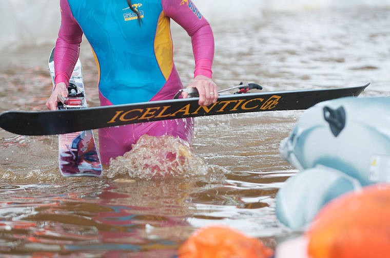 <p>A competitor makes his way out of the pond after a fall Saturday afternoon during the 9th Annual Whitefish Mountain Resort Pond Skim. April 5, 2014 in Whitefish, Montana. (Patrick Cote/Daily Inter Lake)</p>