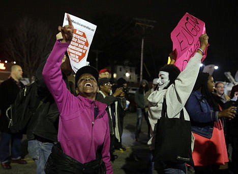 &lt;p&gt;Protesters demonstrate across the street from the Ferguson Police Department in Ferguson, Mo., on March 12.&lt;/p&gt;