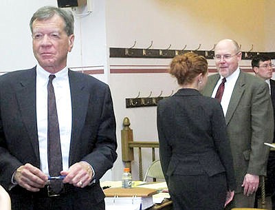 <p>Commissioner of Political Practices Jonathan Motl, left, and state Rep. Art Wittich, second from right, speak to their legal teams after the first day of Wittich's campaign finance trial in Helena, Montana, on March 28, 2016. Motl accuses Wittich of taking illegal corporate contributions from groups associated with the National Right to Work Committee (AP Photo/Matt Volz)</p>